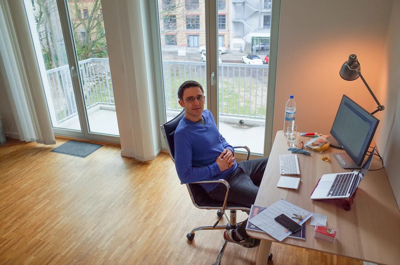 Nick kicks back at his new desk, with a view over the Factory campus.
